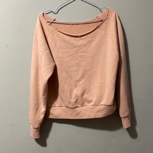 Over the shoulder.can be warm for a size small also.Warn twice.